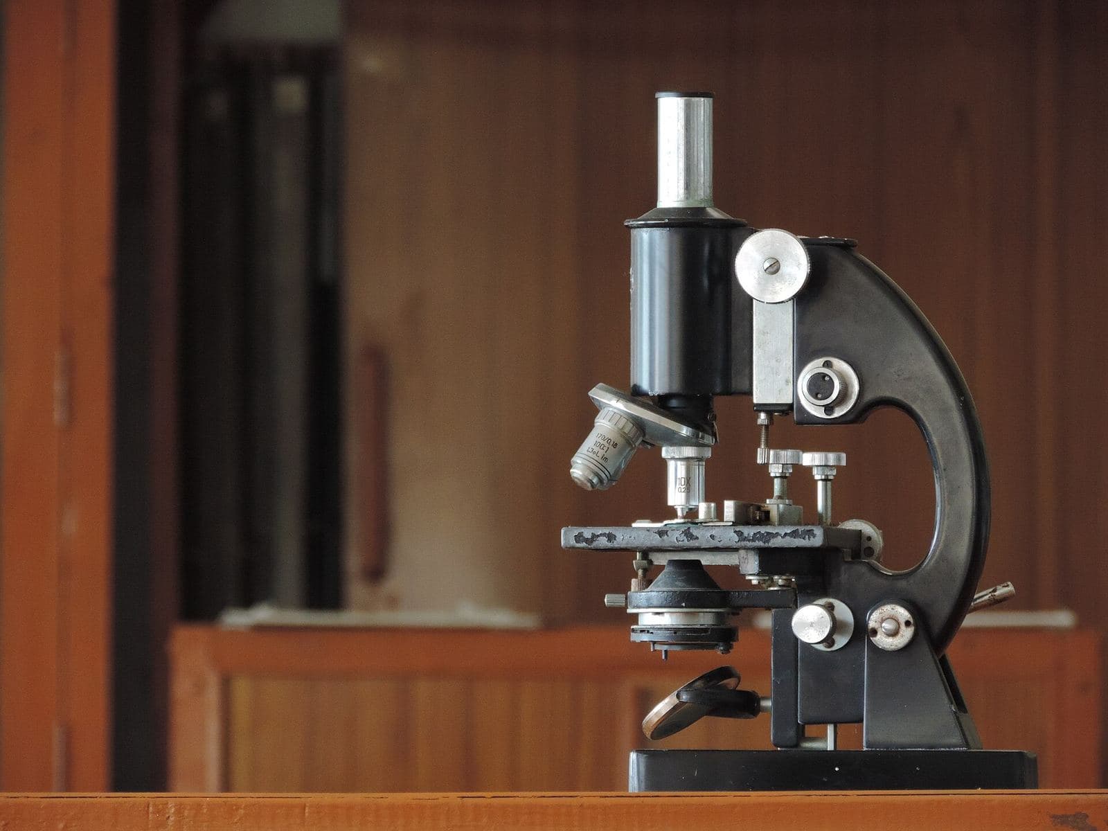 A compound light microscope on a laboratory table